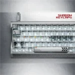 Celestial Star artisan keycap set, hollowed aluminum frame, crystal transparency. Multiple angles reveal intricate design and light-reactive details.