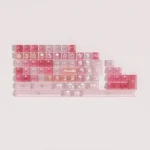 Playful strawberry dessert-themed PBT keycaps set, showcasing pastel designs for a whimsical, personalized keyboard.