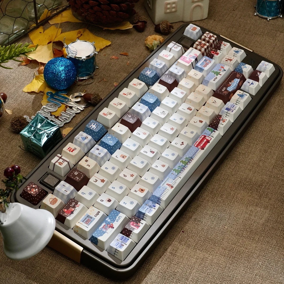 Artistic Whimsical Christmas Whispers PBT keycaps set, displaying enchanting winter wonderland scenes and crisp, durable legends for a festive setup.