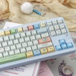Vibrant Crayon Shin-chan PBT keycaps set, shown from various angles. Durable PBT material and playful anime characters for custom keyboard customization.