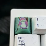 Premium titanium Mitsuri Kanroji artisan keycap, showcasing vibrant pink and green metallic Demon Slayer craftsmanship.