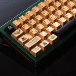 Exquisite Egypt Black & Gold PBT keycap set shown from various angles, detailing intricate hieroglyphs and the luxurious metallic-look finish.