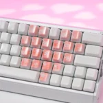 Exquisite artisan translucent ceramic heart supplement keycaps set showcasing delicate cherry blossoms, graceful butterflies, and heart motifs from multiple angles.