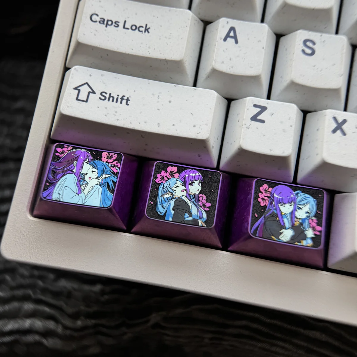 Premium Frieren Fern titanium artisan keycap, prominently displaying intricate anime character designs on anodized titanium. A stunning Frieren keycap.