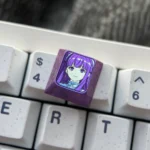 Frieren Titanium Artisan Keycap, multiple angles. Exquisite Frieren design, vibrant colors, luxurious texture. An enchanting keyboard accent.