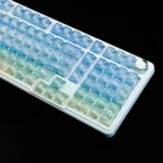 Frosted PC gradient keycaps set revealing their blue-white translucent blend. The unique frosted texture diffuses light, creating a serene ocean aesthetic.