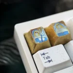 A collection of detailed images showcasing the premium titanium Goblin Slayer Sword Maiden ESC keycap, highlighting its intricate metallic design.