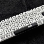 Urban Graffiti PBT Keycaps Set, displaying vibrant street art designs and durable PBT construction from various angles, ensuring universal fit.