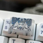 Gundam Titanium Keycap product gallery showcasing its aerospace-grade titanium, iconic mecha design, and futuristic industrial metallic finish from multiple angles.