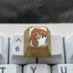 Multiple angles of the premium Haibara Ai titanium ESC keycap, showcasing its meticulously etched iconic imagery and polished finish.