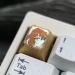 Close-up view of the premium Haibara Ai titanium ESC keycap from multiple angles, showcasing the meticulously etched iconic imagery on polished titanium.