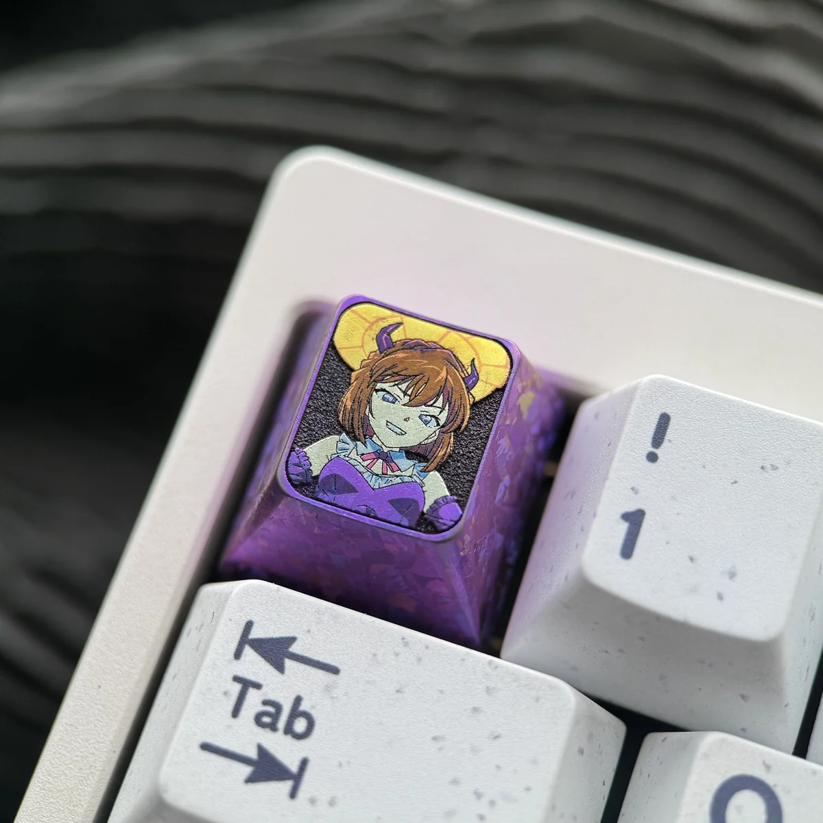 Multiple angles of the premium titanium Haibara Ai ESC keycap, showcasing the meticulously etched Detective Conan character art on polished metallic.