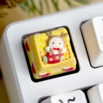 Handcrafted Christmas keycap, a whimsical 3D resin sculpture. Vibrant holiday colors and festive scenes are shown from multiple angles.