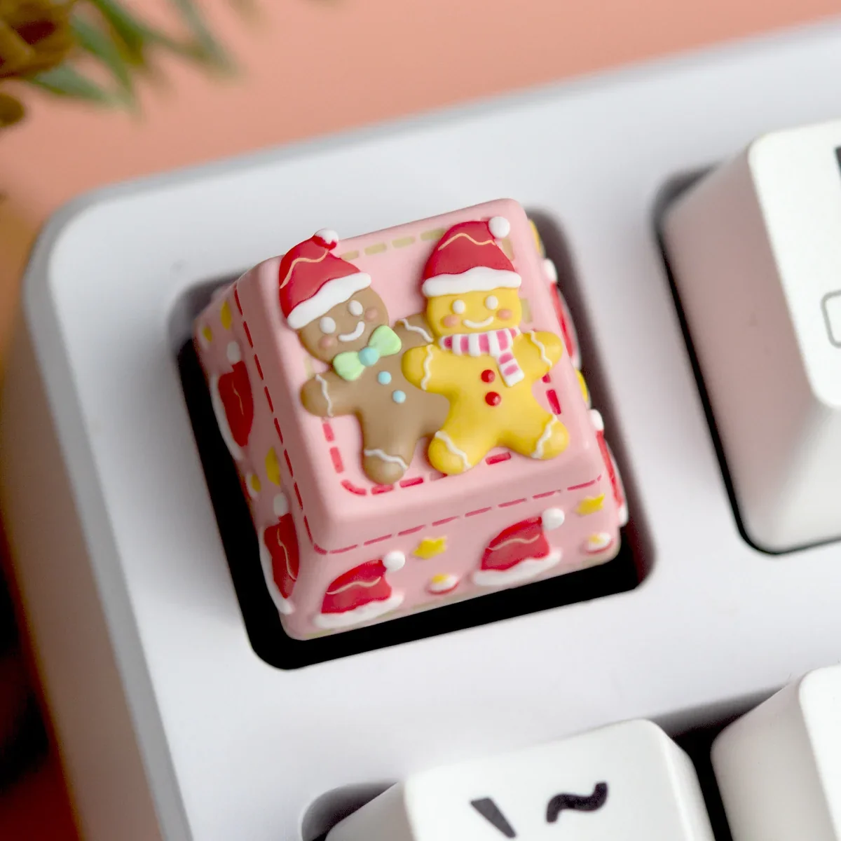 Close-up of a handcrafted Christmas resin ESC keycap, showcasing its whimsical 3D festive scene from multiple artistic angles with vibrant holiday design.