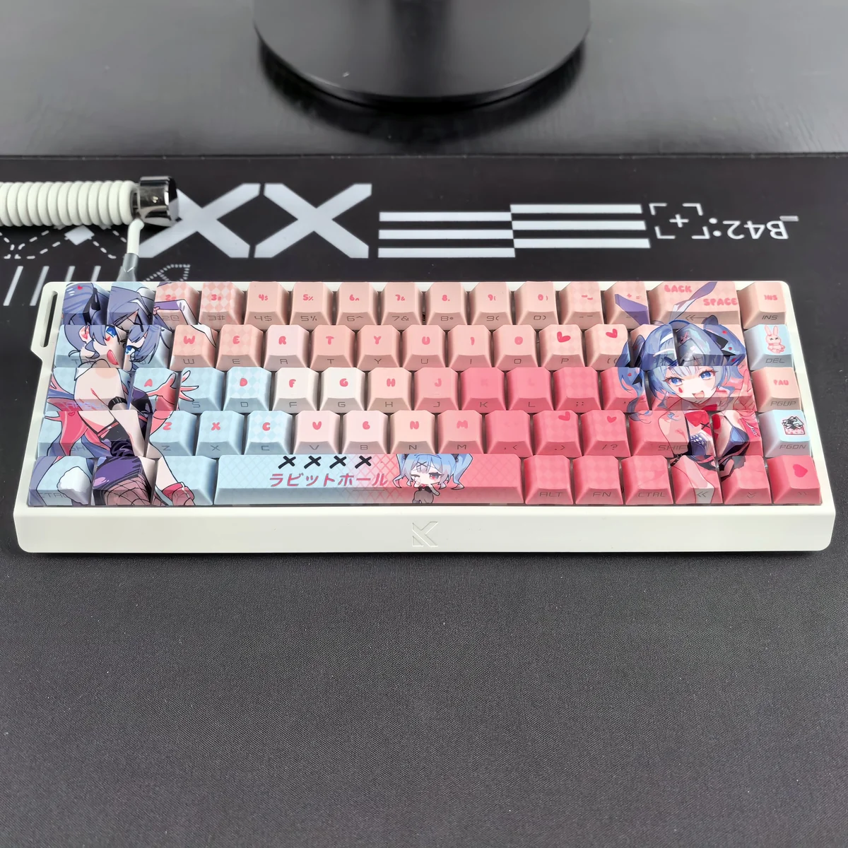 Hatsune Miku Rabbit Hole PBT keycaps set, translucent side-prints featuring whimsical VOCALOID art, beautifully illuminated for vibrant RGB key.