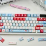 Iconic Hello Kitty Happy Travel PBT keycaps set featuring pastel colors and whimsical diary motifs for a nostalgic, custom keyboard aesthetic.