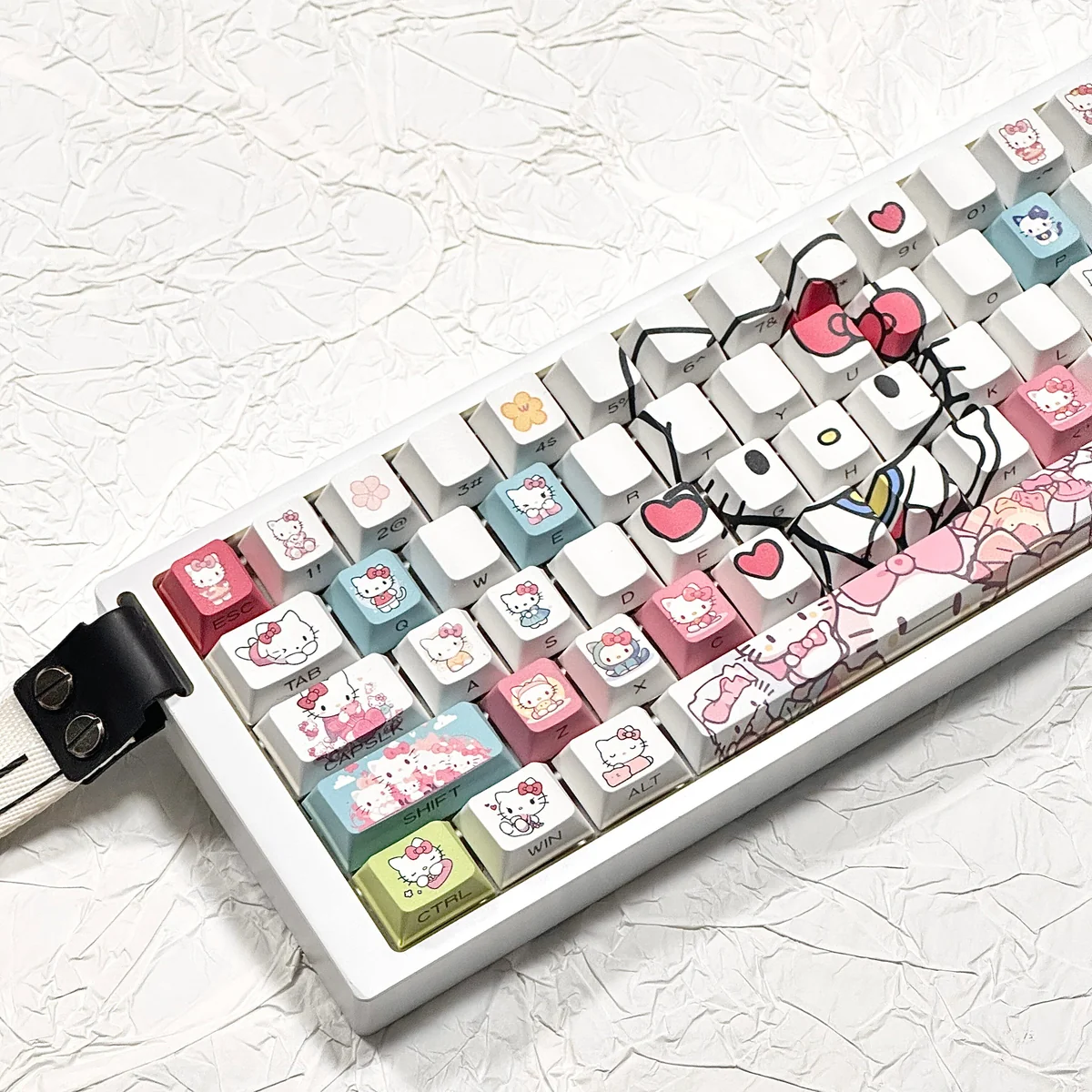 Angled view of iconic Hello Kitty PBT side-lit keycaps set, showcasing vibrant colors and crisp side-printed legends, perfect for RGB keyboards.