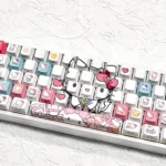 A collection of Hello Kitty PBT side-lit keycaps set from multiple angles, highlighting the durable legends and iconic design ready for vibrant RGB keyboard.