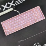 Detailed gallery images of the iconic Hello Kitty frosted pink keycap set, highlighting its whimsical character design and captivating backlit glow from multiple angles.