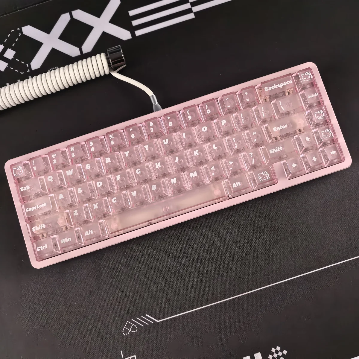 Hello Kitty Frosted Pink Backlit Keycap Set from multiple angles, highlighting its whimsical design, soft pink hue, and translucent glow.