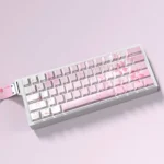 Vibrant Ichika Nakano PBT keycaps set with glowing backlit side-printed legends and playful pink accents, shown from various angles.