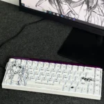 Isabelle Keycaps PBT set, artfully showcased from multiple perspectives. Elegant original character art with subtle side-printed RGB backlighting.