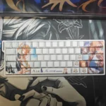 Close-up of Kamio Misuzu AIR PBT keycaps set, showcasing the elegant side-printed legends and gentle backlighting, capturing the anime's serene aesthetic.