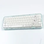 Playful Maltese Dog Keycap Set gallery showcasing its smooth ceramic feel and whimsical side-engraved puppy design from various angles.