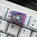 Gallery of the iconic Kurumi Tokisaki Titanium keycap from Date A Live, highlighting its vibrant anime art and premium metallic durability.