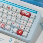 Multiple product shots of the serene Whisper blue PBT keycaps set, showcasing their premium material and minimalist design from various angles.