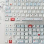 Serene Whisper blue PBT keycaps set displayed from multiple angles, highlighting their premium feel and minimalist, clean design for a modern keyboard setup.