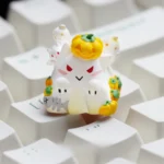 Handcrafted luminous resin Halloween ESC keycap from multiple angles, showcasing its charming glowing pumpkin design, translucent artistry, and playful design.