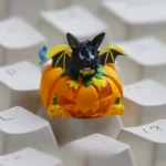Handcrafted luminous resin Halloween ESC keycap showcasing detailed pumpkin designs from multiple angles, glowing playfully in translucent material.