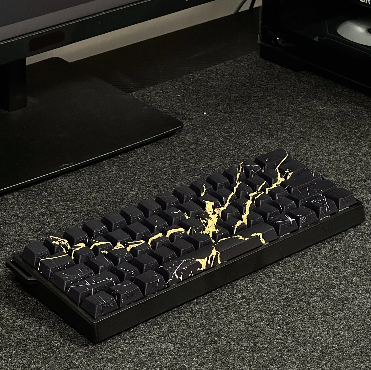 Close-up gallery of elegant Black Gold Marble PBT keycaps set, showcasing the luxurious side-engraved legends and natural stone aesthetic from multiple angles.