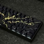 Gallery of elegant Black Gold Marble PBT keycaps set, showcasing their luxurious pattern and sleek side-engraved legends from multiple angles for a premium design.