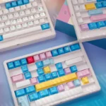 Memphis Keycaps Set product gallery showcasing vibrant retro-futurist desk art, featuring bold geometric shapes and playful postmodern patterns from various angles.