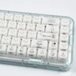 Miffy crystal jelly MAO keycaps set from various angles, showcasing their translucent pastel pink and white glow with side-engraved Miffy details.