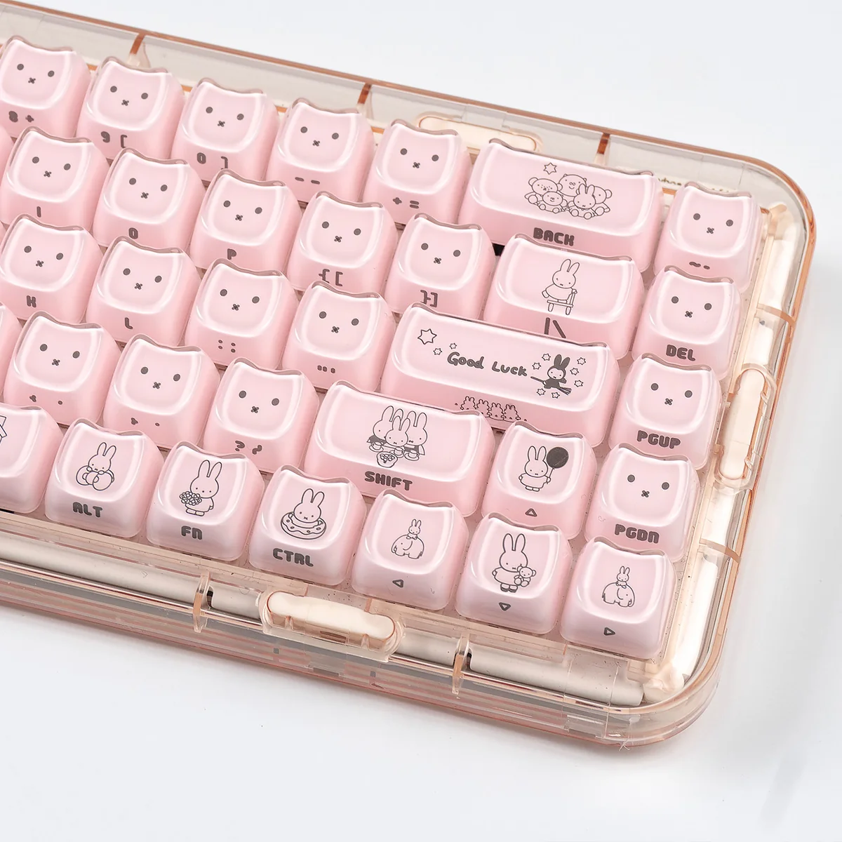 Playful Miffy crystal jelly side-engraved MAO keycaps set from different angles, highlighting their cute translucent pastel pink and white aesthetic.
