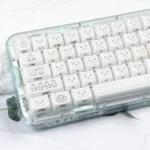 Close-up views of Miffy crystal jelly keycaps set featuring side-engraved Miffy rabbits in pastel pink and white, highlighting their translucent design.