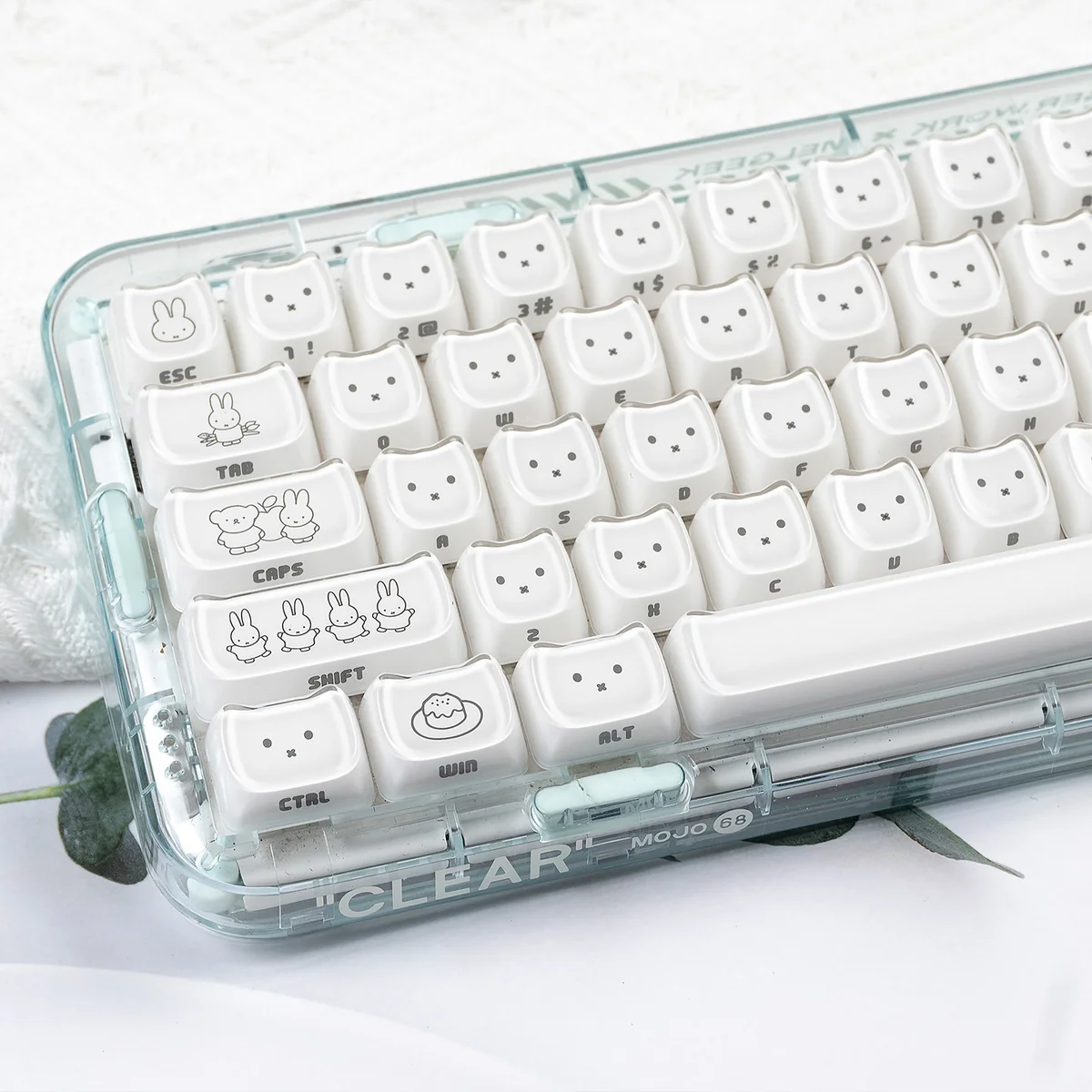 Close-up views of Miffy crystal jelly keycaps set featuring side-engraved Miffy rabbits in pastel pink and white, highlighting their translucent design.