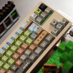 Gallery view of durable PBT Minecraft pixel art keycaps set, showing various angles of iconic green pixelated designs for a nostalgic gaming setup.