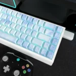 Angled view of the Mio Akiyama K-On! PBT keycaps set, highlighting their exclusive, vibrant side-lit anime character art and subtle musical motifs for fans.