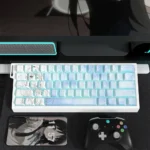 Exclusive Mio Akiyama side-lit PBT keycaps set with vibrant K-On! art and subtle musical motifs, prominently displayed.