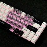 Whimsical Miyu custom PBT keycaps set showcasing original side-printed character art and enchanting translucent heart accents, viewed from multiple artistic angles.