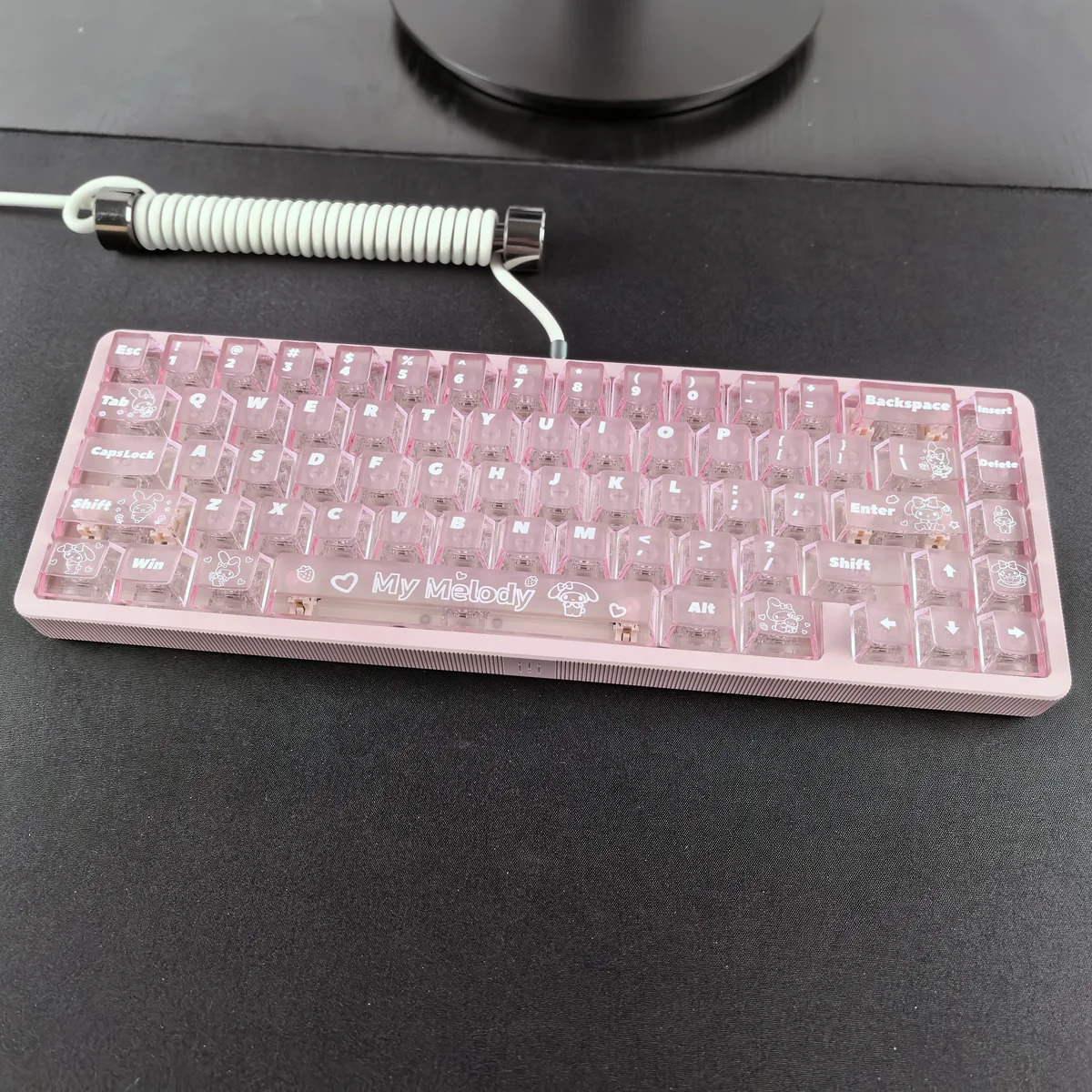 My Melody frosted translucent PC keycap set in soft pink, showcasing the iconic character's whimsical glow.
