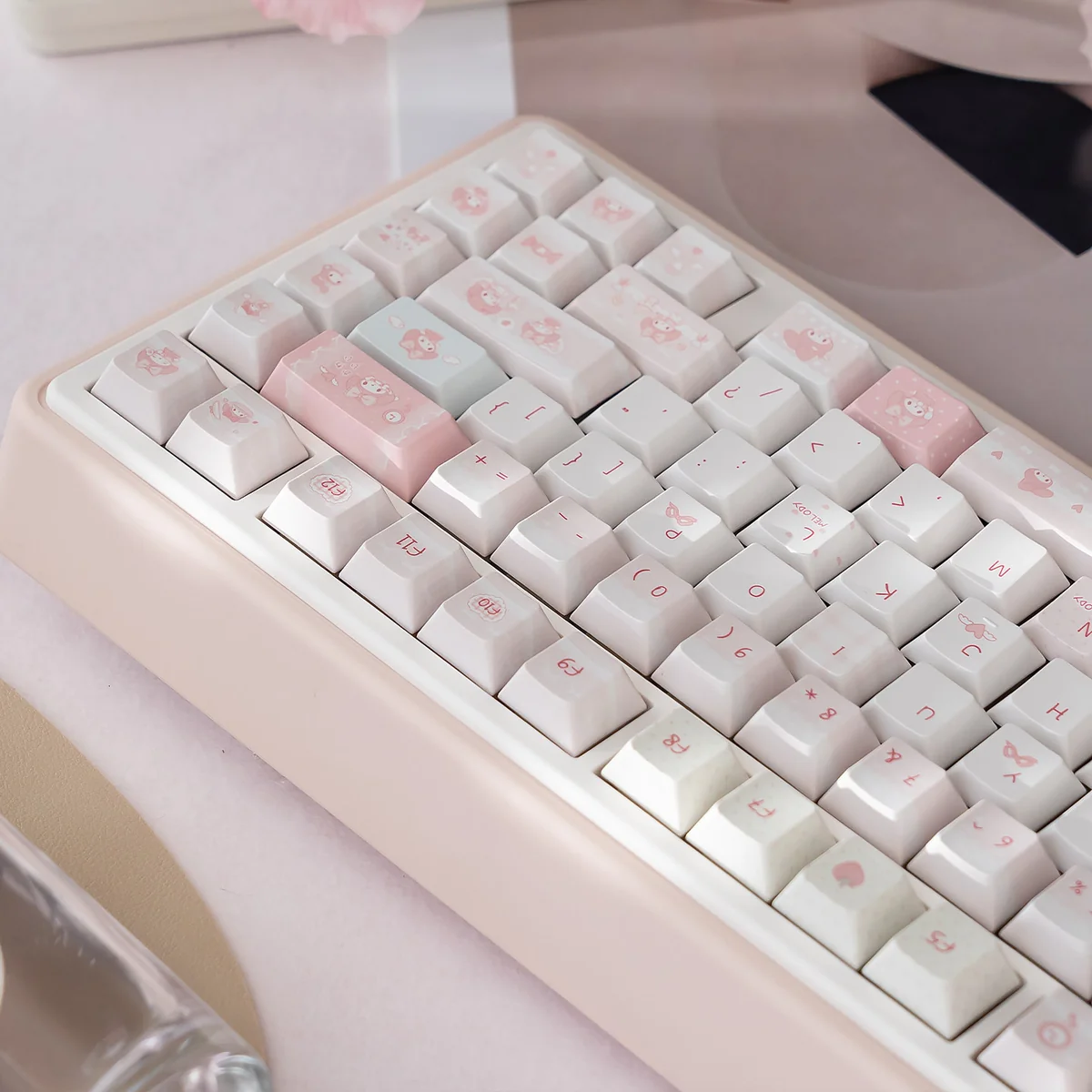 Cute pastel pink My Melody mechanical keyboard shown from multiple angles, highlighting its silent keys and tri-mode connectivity for playful fun.