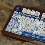 Detailed shot of the Mysterious Garden PBT keycap set, featuring exquisite dye-sublimated ancient garden motifs and delicate flora from an artistic angles.