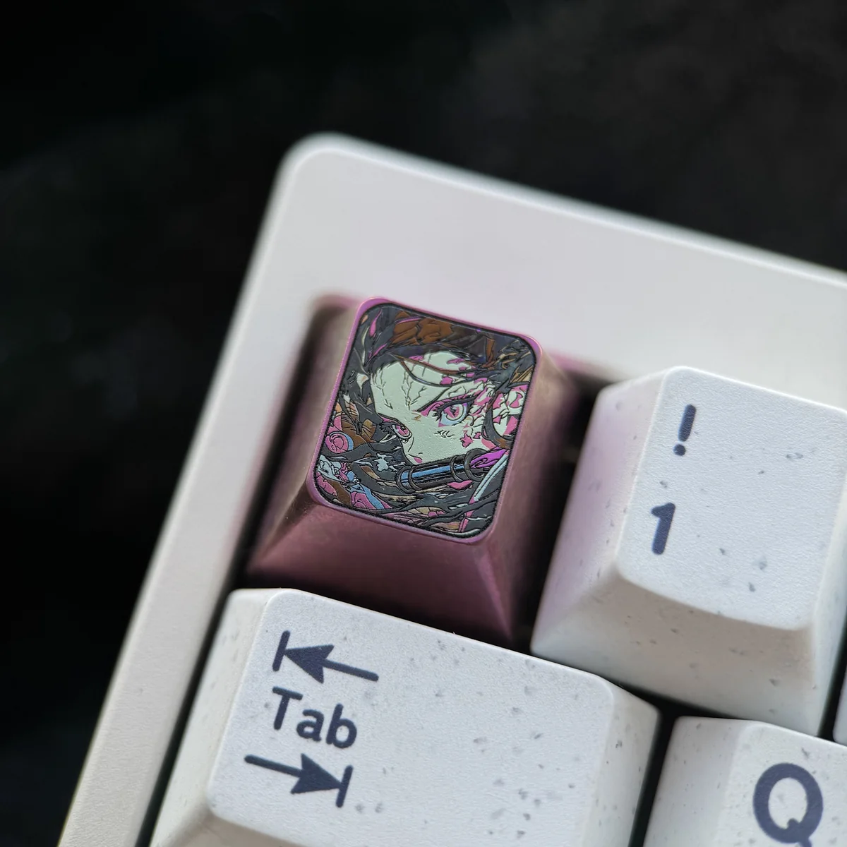 Close-up views of a premium handcrafted Nezuko titanium keycap for the ESC position, showcasing its intricate artisan details and iconic Demon Slayer inspired.