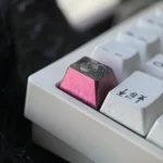 Detailed views of the handcrafted Nezuko Titanium Demon Slayer ESC keycap, highlighting premium artisan finish, iconic colors, and durable titanium.