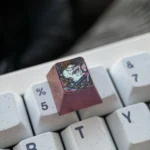 Artistic views of the handcrafted Nezuko Titanium ESC keycap, highlighting its intricate Demon Slayer details and premium, durable finish from various angles.